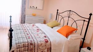 מיטה או מיטות בחדר ב-Appuntamento Al porto