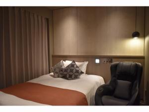 Letto o letti in una camera di Hotel Grand View Takasaki