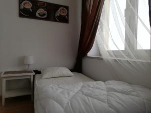 Posteľ alebo postele v izbe v ubytovaní Lorf Hostel&Coffee
