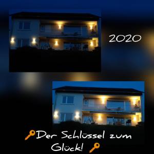 une photo d'une maison la nuit dans l'établissement Fewo Traumblick, à Kreuzwertheim