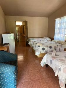 Postel nebo postele na pokoji v ubytování Hotel Uran