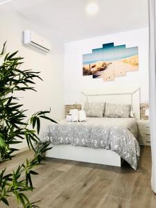 En eller flere senge i et værelse på Luxury Carihuela Beach