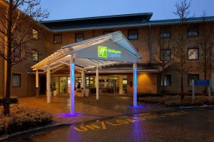 a building with a sign in front of it at Holiday Inn Express Milton Keynes, an IHG Hotel in Milton Keynes