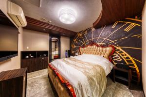 a bedroom with a bed with a star wars mural at Hotel Luna Ibaraki(Adult Only) in Ibaraki