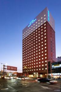 a building with a sign on the top of it at Toyoko Inn Seoul Yeongdeungpo in Seoul