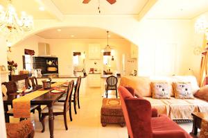a living room and kitchen with a table and a couch at 那須KIRIN邸スイートvilla in Nasu-yumoto