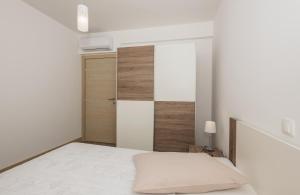 Posteľ alebo postele v izbe v ubytovaní Apartments Villa Hadria
