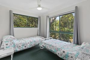 A bed or beds in a room at Billabong