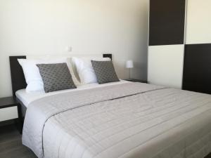 Posteľ alebo postele v izbe v ubytovaní Apartments Villa Hadria