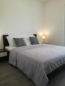 Posteľ alebo postele v izbe v ubytovaní Apartments Villa Hadria