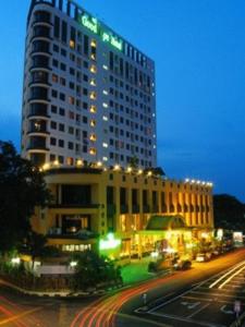 a large building at night with a street in front of it at Good Hope Hotel in Skudai