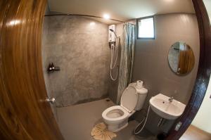 a small bathroom with a toilet and a sink at SLEEP TIGHT at Chumphon in Chumphon +38 photos