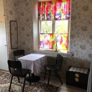 a dining room with a table and a window at Billingehill Bed&Breakfast in Billinge