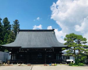a pagoda with a roof on top of it at Utatei Sou in Takayama