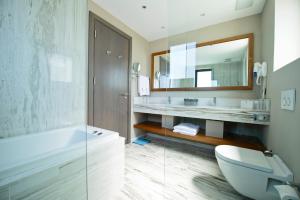 A bathroom at Ramada Resort by Wyndham Bodrum