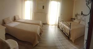 Postel nebo postele na pokoji v ubytování Hotel Monti