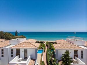 a view of the ocean from the balcony of a house at Atlantis Gardens in Mazotos