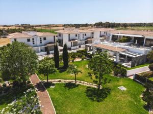 an aerial view of a house with a yard at Atlantis Gardens in Mazotos
