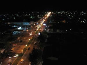 a city street at night with lights at De a Dos in San Rafael