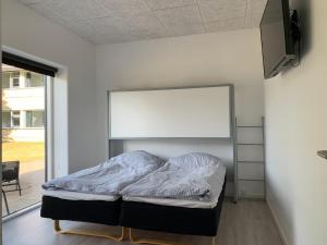 Postel nebo postele na pokoji v ubytování Dana Cup SportsCenter