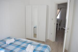 Postel nebo postele na pokoji v ubytování Apartments Janja