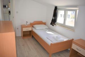 Postel nebo postele na pokoji v ubytování Apartments Janja