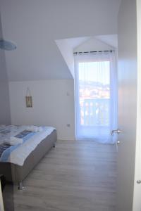 Postel nebo postele na pokoji v ubytování Apartments Janja