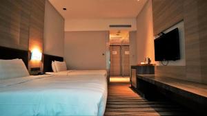 Postel nebo postele na pokoji v ubytování City Suites - Kaohsiung Chenai