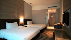 Postel nebo postele na pokoji v ubytování City Suites - Kaohsiung Chenai