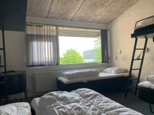 Postel nebo postele na pokoji v ubytování Dana Cup SportsCenter