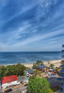 a view of a beach and the ocean at Holiday Home SLAVIA NEW 601 z widokiem na morze in Międzyzdroje