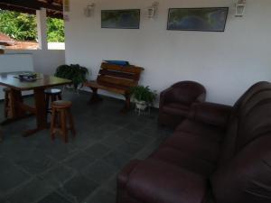 Et sittehjørne på Recanto Casa de Pedrinha - Aptos para temporada e finais de semana