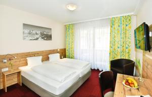 Ένα ή περισσότερα κρεβάτια σε δωμάτιο στο Heinrichshof