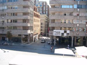 a view of a city street with tall buildings at Hostal Tudescos in Madrid