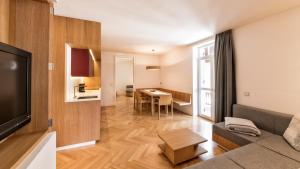 a living room with a couch and a table at Apartment Genziana in Ortisei
