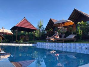 Bazén v ubytování Bukit Catu Bungalows nebo v jeho okolí