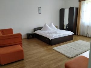 מיטה או מיטות בחדר ב-Pensiunea Agroturistica Casa Runc