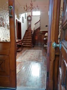 an open door to a room with a stairway at Kiltariff Hall Country House in Rathfriland +16 photos