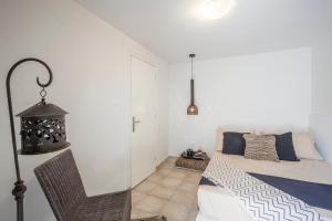 A bed or beds in a room at Acroyali Beach House