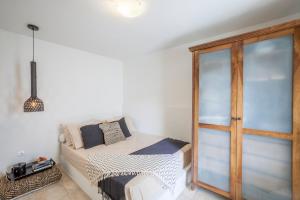 A bed or beds in a room at Acroyali Beach House