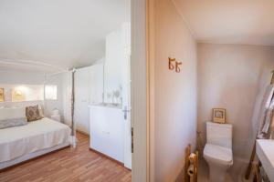 A bed or beds in a room at Acroyali Beach House