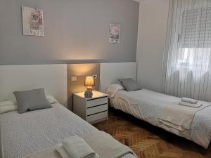 A bed or beds in a room at Piso Camino de Santiago 2