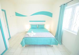 Letto o letti in una camera di Abiki Mauritius