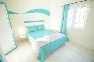 Letto o letti in una camera di Abiki Mauritius