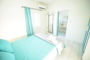 Letto o letti in una camera di Abiki Mauritius