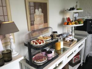 a breakfast buffet with food on a table at B&B Goed Ten Hulle in Pittem