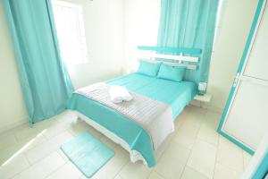 Letto o letti in una camera di Abiki Mauritius