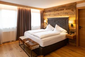 Łóżko lub łóżka w pokoju w obiekcie Olympia-Relax-Hotel Leonhard Stock