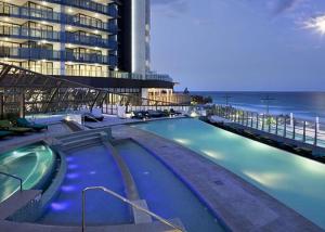 
The swimming pool at or near H Resort Orchid Avenue Surfers Paradise- Holidays Gold Coast
