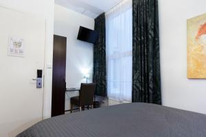 Ліжко або ліжка в номері Quentin Amsterdam Hotel